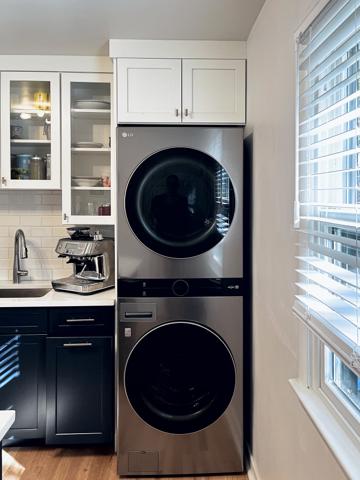Stacked LG washer and dryer in the unit